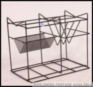 A retro 1970's black metal wire work record / vinyl hi -fi stand of angular form