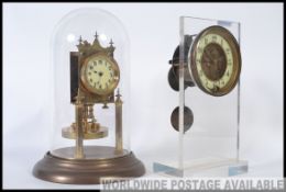 A late 19th century eight day clock movement presented in a contemporary perspex mount,