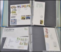 First Day Covers; A large collection of vintage First Day Covers, spanning two albums.
