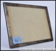 A silver hallmarked picture frame bearing hallmarks for Birmingham 1907 by Charles Penny Brown,