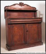 A Victorian mahogany chiffonier sideboard raised on plinth base with cupboards under drawers.