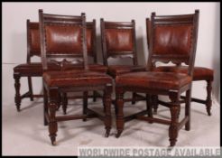 An excellent set of 6 Victorian leather and oak dining chairs in the manner of Lamb of Manchester.