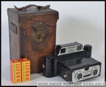 A fabulous leather cased Coronet 3-D binocular viewfinder.