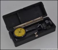 An unusual cased engineers instrument by Federel having central gauge within original box L10cm