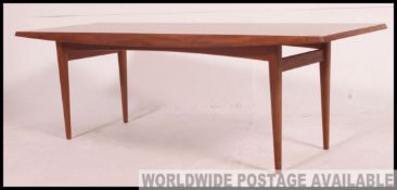 A rare high quality teak coffee table. Vintage mid century by Gordon Russell ( Label to underside).