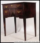 A 18th / 19th century Georgian mahogany kneehole lowboy desk raised on squared legs with kneehole