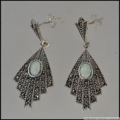 A pair of silver marcasite and opal drop earrings