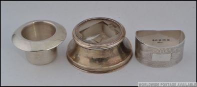 A collection of 3x silver items;