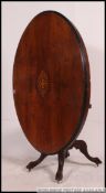 A 19th century Victorian mahogany inlaid breakfast / loo tilt top dining table.