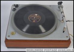 A vintage B&O Bang And Olufsen record deck with acrylic hood dating to the 1970's.