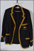 A vintage early 20th century school's / sports blazer having gold and black piping to the hem's,