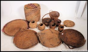 A good collection of vintage whicker baskets and trays,
