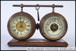 An unusual 1930's oak clock and barometer set.
