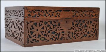 A 19th century Victorian lattice worked mahogany ladies workbox / jewellery box having hinged top