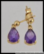 A pair of 18ct gold amethyst set drop earrings of teardrop form. Total weight 2.