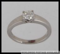 An 18ct white gold and single stone diamond ring being claw mounted, the diamond approx 40pnts.