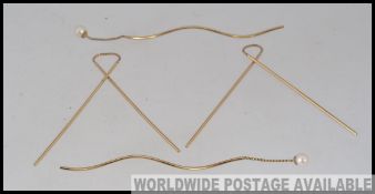 Two pairs of vintage 375 9ct gold chain drop earrings one pair with pearl finial marked 375.