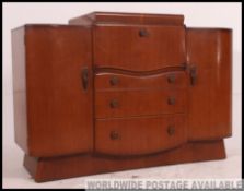 A 1930's Art Deco oak cocktail drinks cabinet / sideboard with central metamorphic drinks cabinet