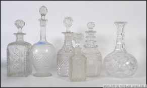 A collection of 5x crystal / glass decanters - various shapes and forms.