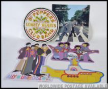 Quantity of BEATLES tin signs.