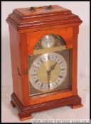 A good quality antique revival oak cased english bracket clock having good brass movement with