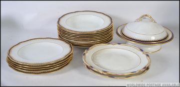 A set of 19th century blue and white Coalport dinner plates having blue banded edges with gilded