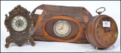 A collection of three vintage 20th century mechanical wind up clocks,