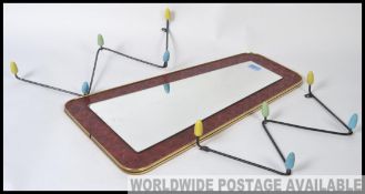 A retro / vintage mid century atomic shaped lozenge wall mirror,