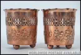 An interesting pair of 1920's Art Nouveau copper wine rests, marked Joseph Sanky and Sons.