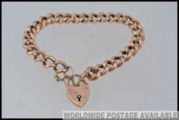 A 9ct gold Gormette chain link bracelet with heart lock clasp with etched decoration to links with