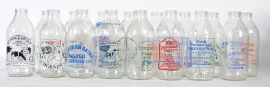 A large collection of retro advertising milk bottles to include Crusha, Kit Kat, Dairies,