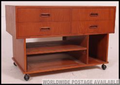 A good 1970's retro teak wood Danish influence entertainment low side cabinet of angular form
