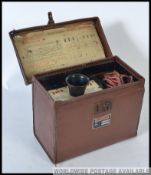 A vintage 20th century leather cased True Test Plug Tester by Runbaker of Manchester.