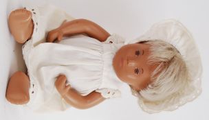 SASHA DOLL: An original vintage 1960's Sasha Doll baby white gown and matching bonnet, blonde hair.