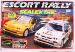 SCALEXTRIC: A Scalextric racing set ' Escort Rally ' appears complete with both cars, controllers,
