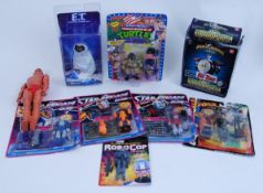 ACTION FIGURES: A collection of assorted action figures, all with a 1980's theme or vintage.