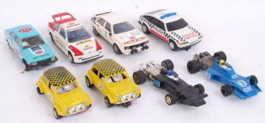 SCALEXTRIC: A collection of 8x vintage Scalextric cars - Escort, Audi Quattro, Minis,