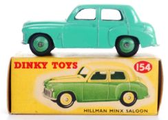 DINKY: An original vintage Dinky Toys 154 Hillman Minx Saloon diecast model car.