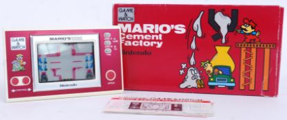 NINTENDO GAME & WATCH; An original vintage Nintendo Game & Watch Mario's Cement Factory pocket game.