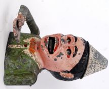 MONEY BOX: An original vintage metal alloy clown money box. Moving eyes, mouth, ears and arm.