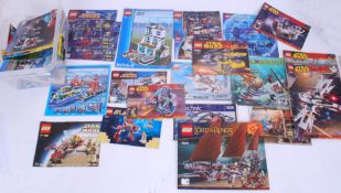 LEGO: A collection of 30+ vintage and assorted Lego set instructions and booklets.