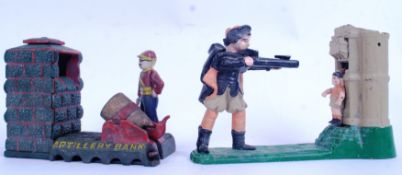 MONEY BOXES: Two vintage reproduction cast iron money boxes, both of a shooting theme.