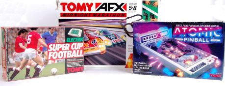 TOMY: A collection of 3x vintage Tomy Electronic toys / games to include AFX Midnight Marathon