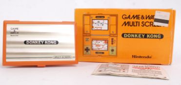 NINTENDO GAME & WATCH; An original vintage Nintendo Game & Watch Donkey Kong pocket computer game.