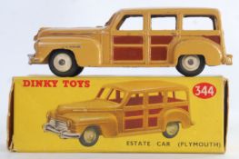 DINKY: An original vintage Dinky Toys 344 Plymouth Estate Car diecast model car.