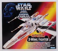 STAR WARS: A Kenner Star Wars Electronic X Wing Fighter vehicle.