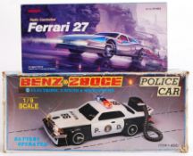 BATTERY OPERATED: Two vintage Battery Operated electric cars - the first being a Benz Z80CE Police