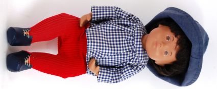SASHA DOLL: An original vintage 1960's Sasha Doll baby - red trousers, checked shirt with hat.