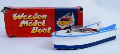 MODEL BOAT: A charming vintage battery powered model boat, within the original box.