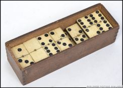 An early 20th century bone faced domino